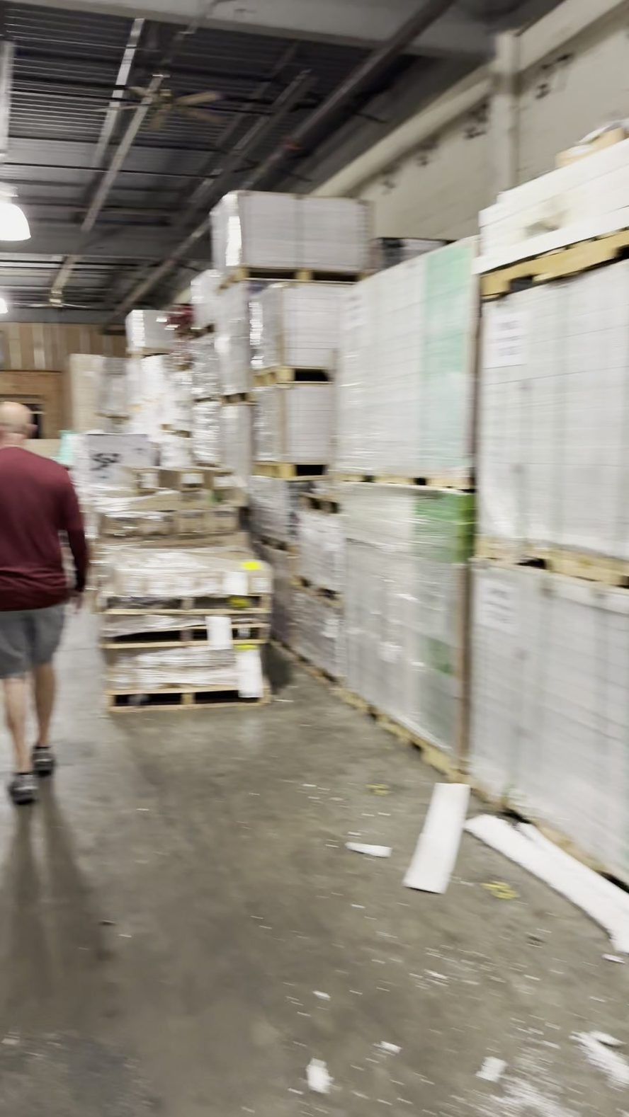 Touring the aisles of a dealer warehouse with our host