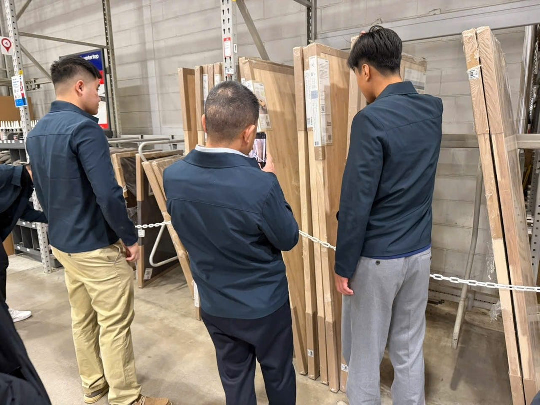 Our team looking at our tops on display in a store