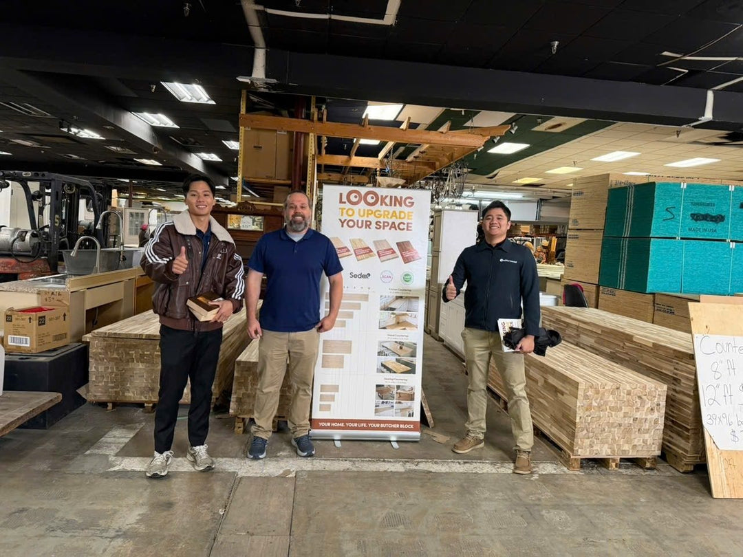 Our team visiting a dealer that carries our tops, with the display stand we brought
