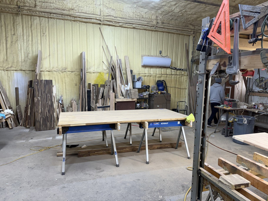 One of our tops on sawhorses in a workshop, ready to be cut to size