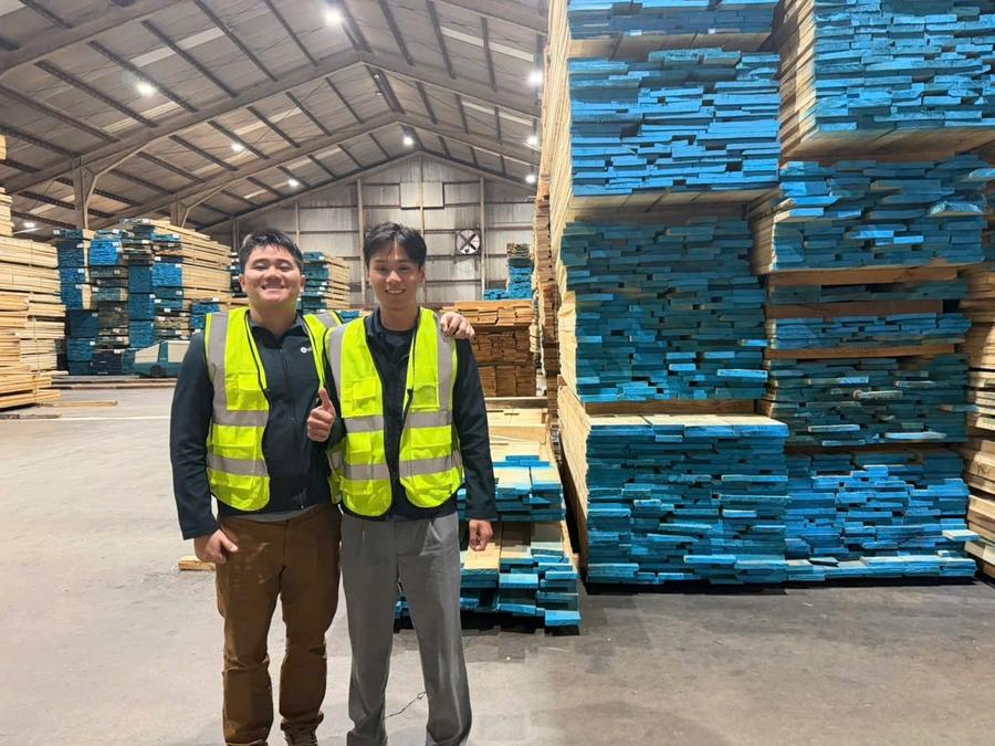 At a lumber yard with a dealer