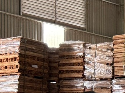 Kiln-dried lumber stacked at our plant