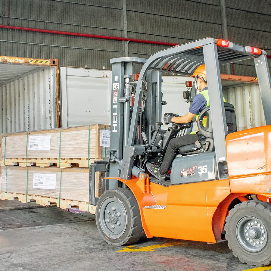 Loading a container at the plant &mdash; the same pallets that land in Georgia