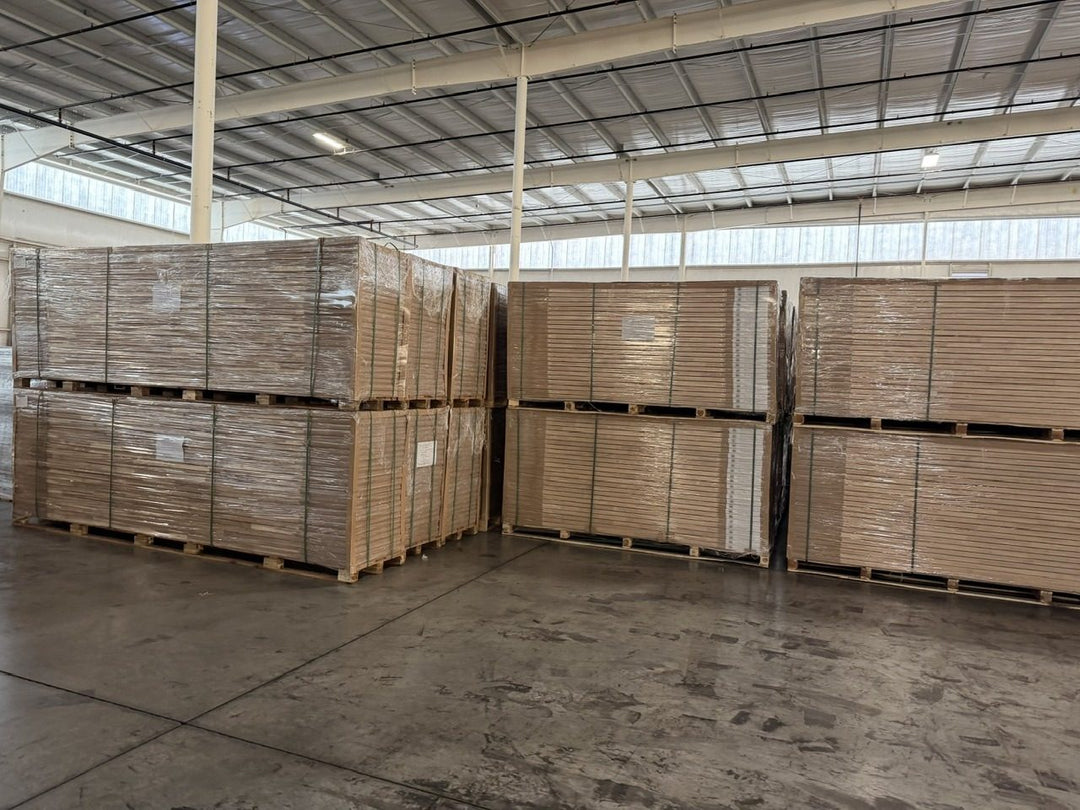 Full pallets of boxed tops stacked two high in the Georgia warehouse